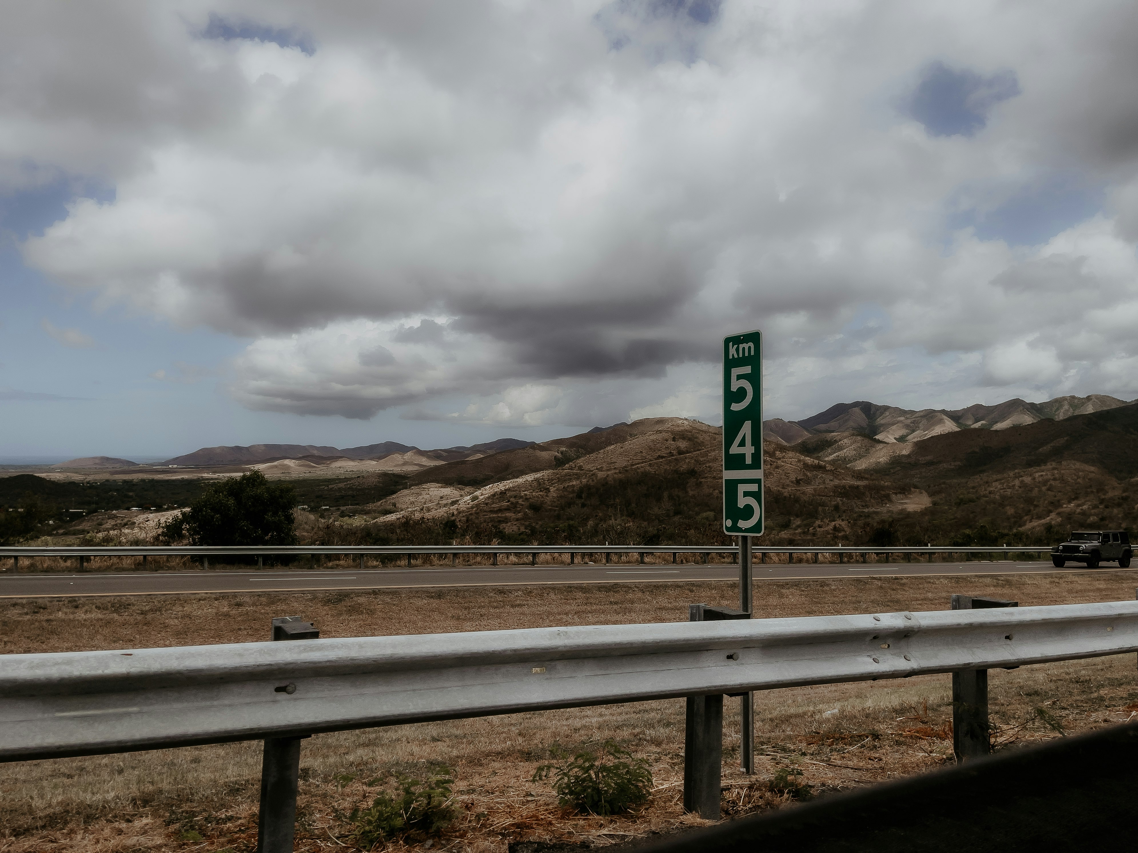 white and blue road sign